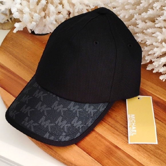 Michael Kors Accessories - Michael Kors 🔥 NWT 🔥 Black Cap w/ logo design on the brim in leather material.